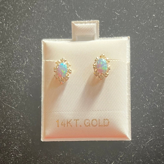 This image displays a pair of elegant "Aritos" earrings presented on a small, white card with the brand name prominently displayed. The earrings are characterized by their sparkling, multicolored design, adding a vibrant and luxurious touch.